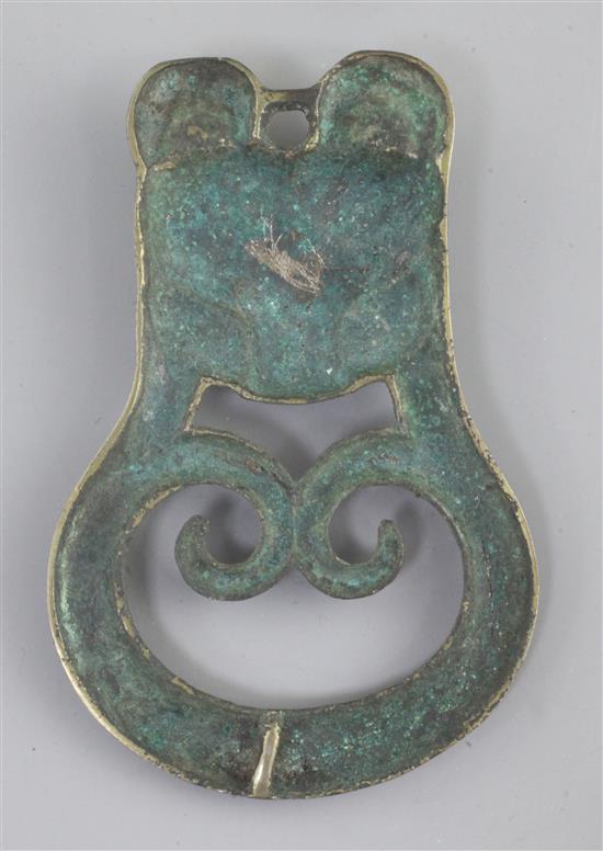 A Chinese archaic bronze tiger-mask harness plaque, probably Han dynasty, 2nd century B.C. - 2nd century A.D., 10.5cm